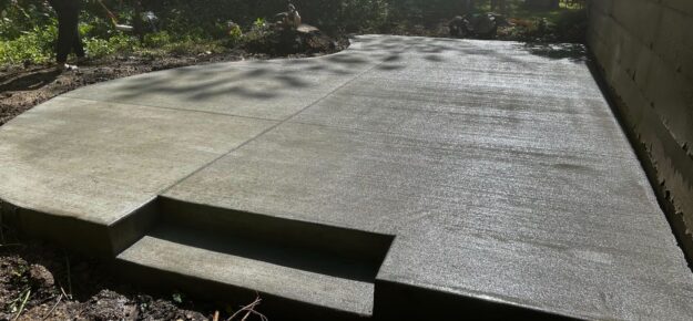 New concrete patio installation showcasing a durable residential outdoor living space